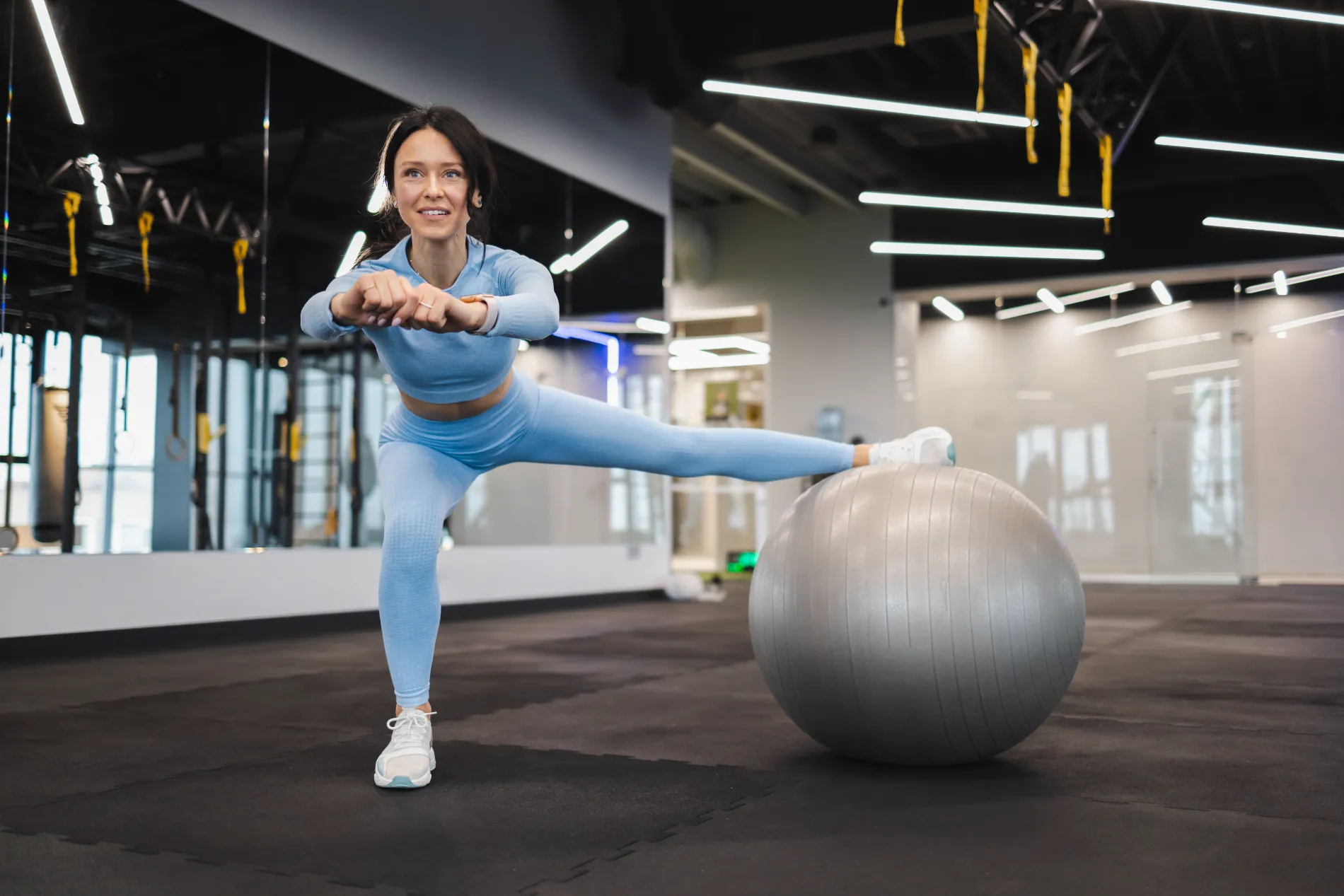 cheerful-woman-working-out-with-a-fitness-ball-in-2022-01-10-21-16-05-utc